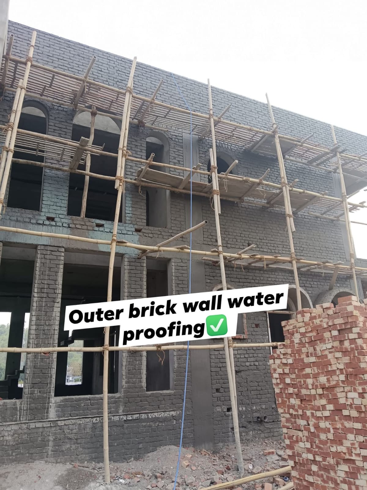 Outer brick wall waterproofing completed — बाहरी दीवार काम पूरा